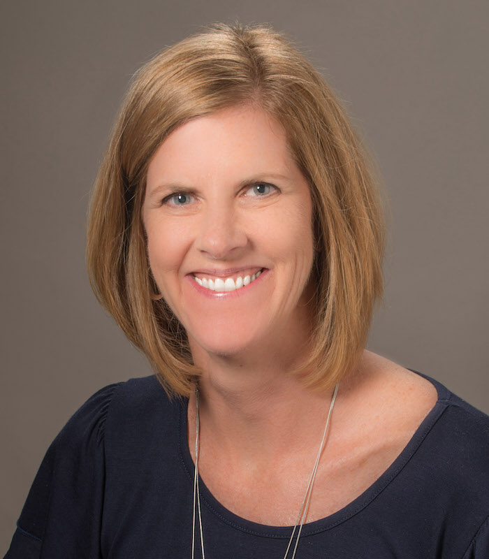 About Our Agency - Mark McDuffie Insurance Agency Inc. Employee Helping Clients Find Appropriate Insurance Coverage