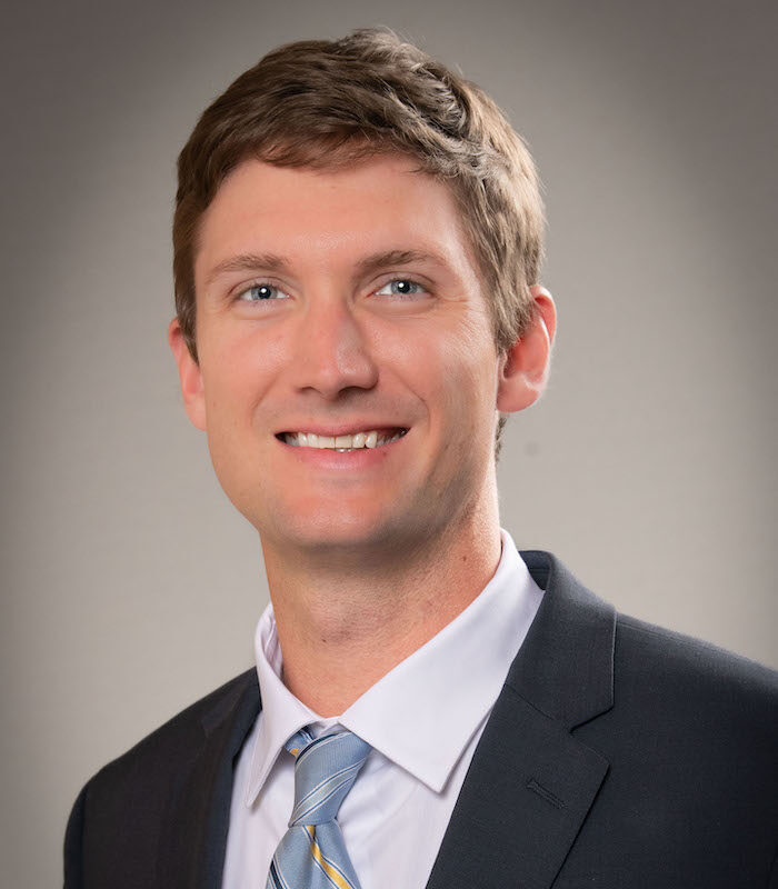 About Our Agency - Mark McDuffie Insurance Agency Inc. Employee Helping Clients Find Appropriate Insurance Coverage